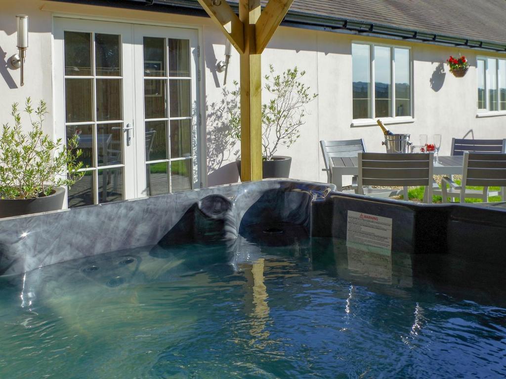 a pool in a house with a water slide at CoachHouse in Acaster Malbis