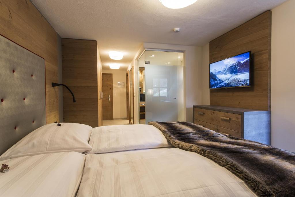 Postel nebo postele na pokoji v ubytování Hotel Valentin