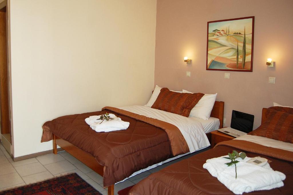 Postel nebo postele na pokoji v ubytování Paris Hotel