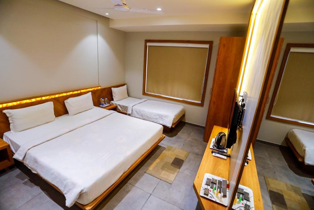 Postel nebo postele na pokoji v ubytování HOTEL OM