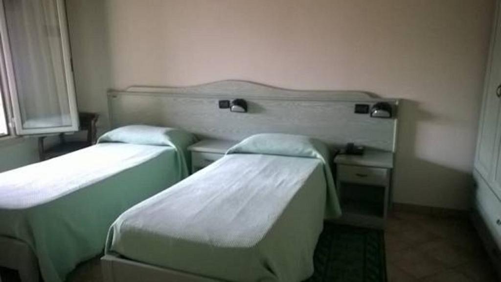 Postel nebo postele na pokoji v ubytování Albergo del Po