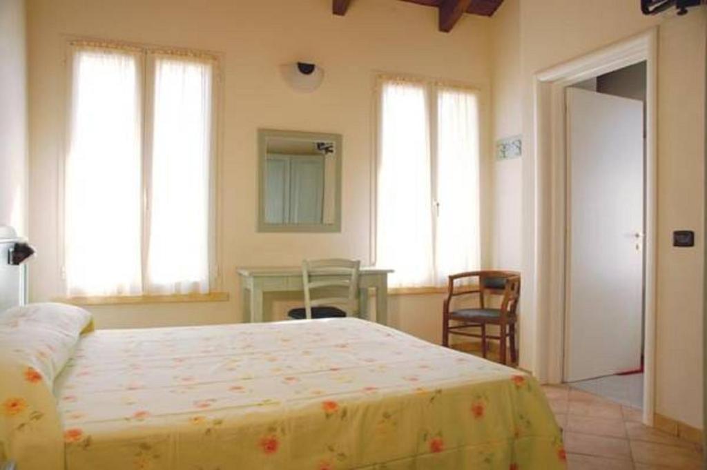 Postel nebo postele na pokoji v ubytování Albergo del Po