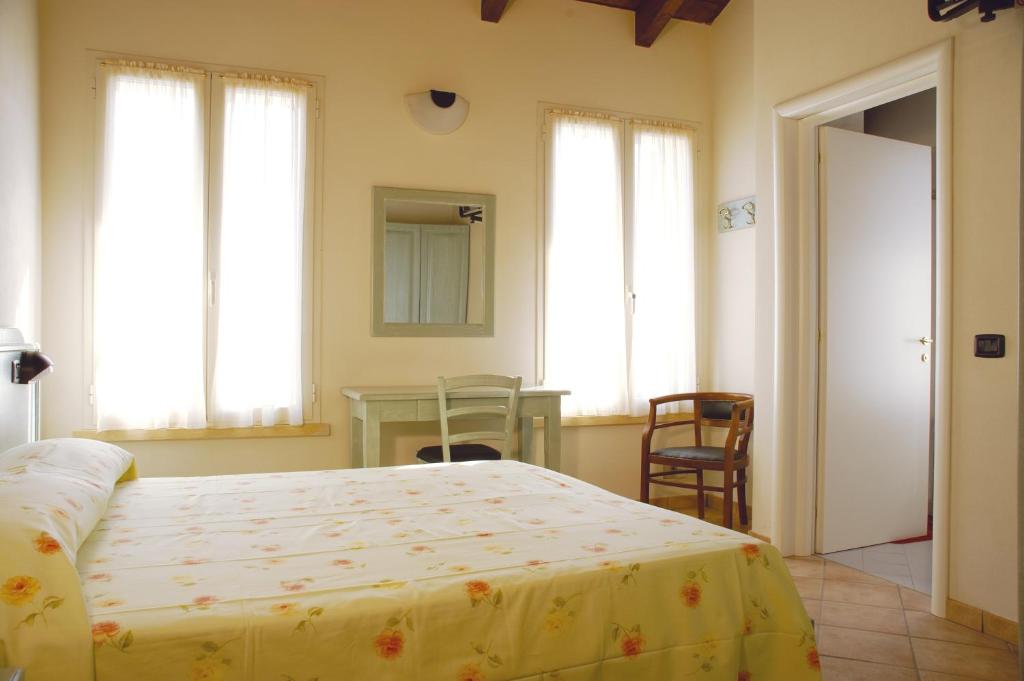 Postel nebo postele na pokoji v ubytování Albergo del Po