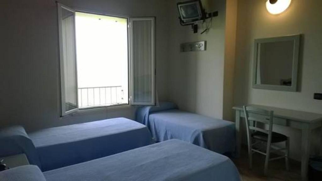 TV a/nebo společenská místnost v ubytování Albergo del Po