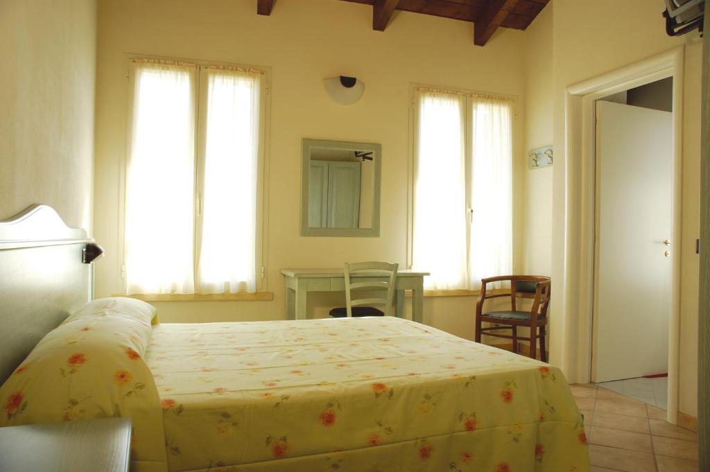 Postel nebo postele na pokoji v ubytování Albergo del Po