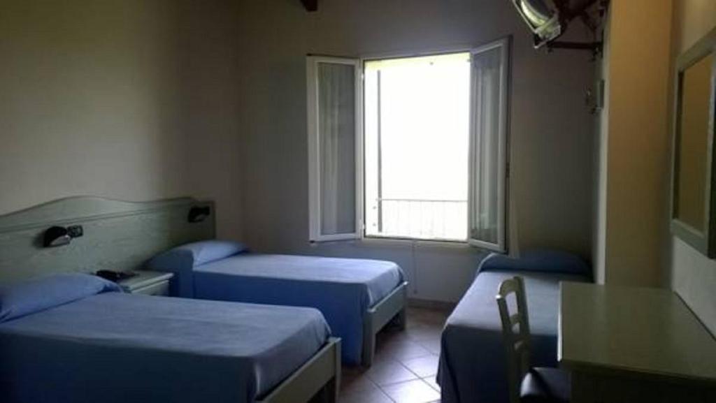 Postel nebo postele na pokoji v ubytování Albergo del Po