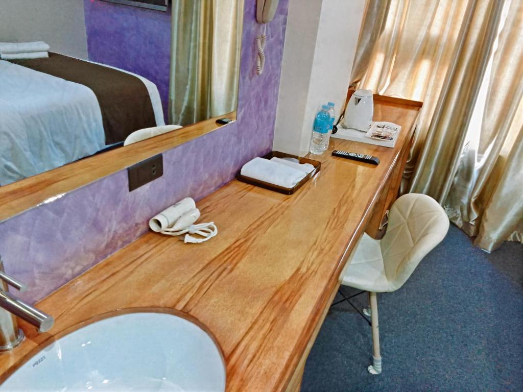 Cama o camas de una habitación en Sempre Premier Inn - MACTAN AIRPORT HOTEL