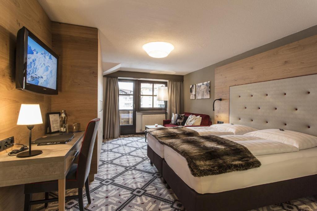 Postel nebo postele na pokoji v ubytování Hotel Valentin