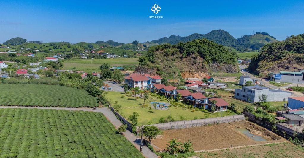 an aerial view of a village in the mountains at Emopea Moc Chau in Mộc Châu