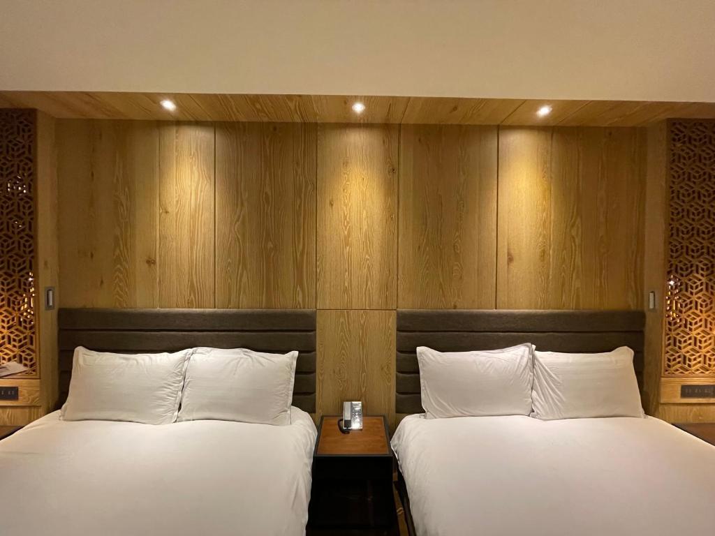 Postel nebo postele na pokoji v ubytování Hotel Château Anping