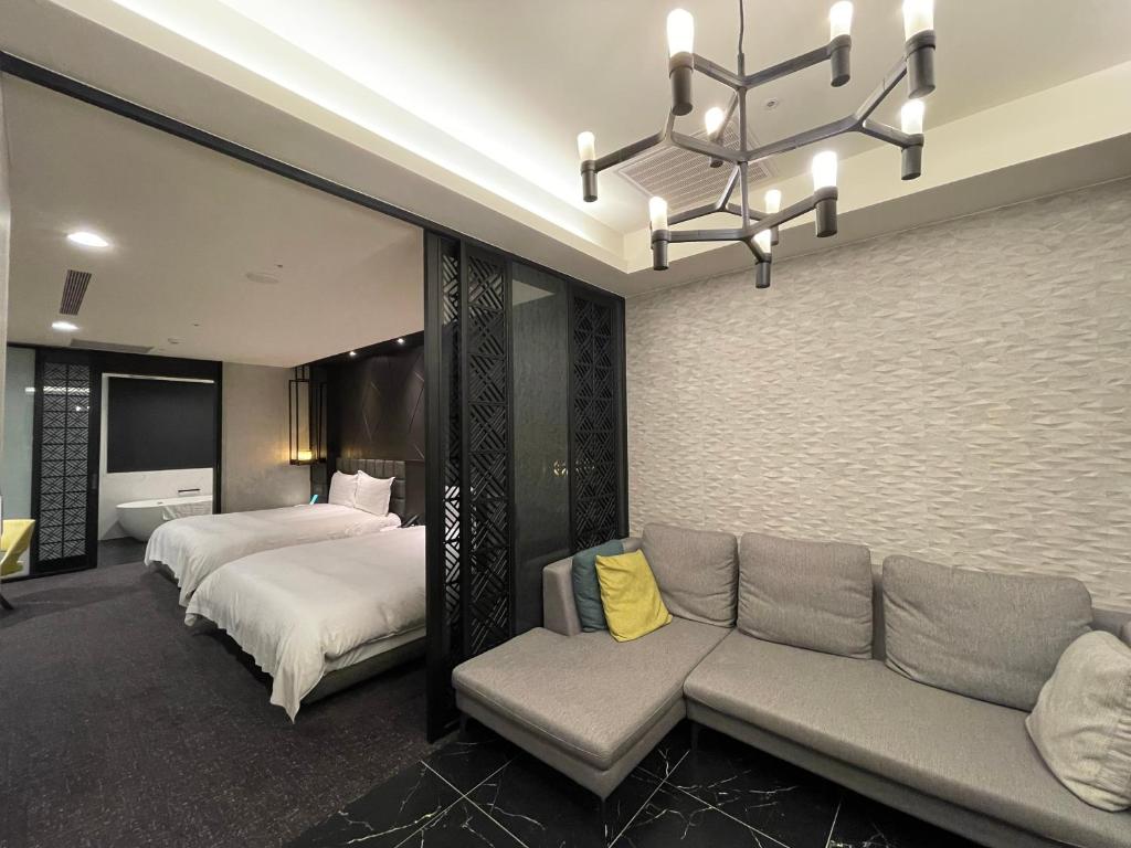 Postel nebo postele na pokoji v ubytování Hotel Château Anping