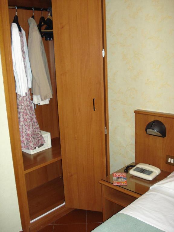 Postel nebo postele na pokoji v ubytování Hotel Corona