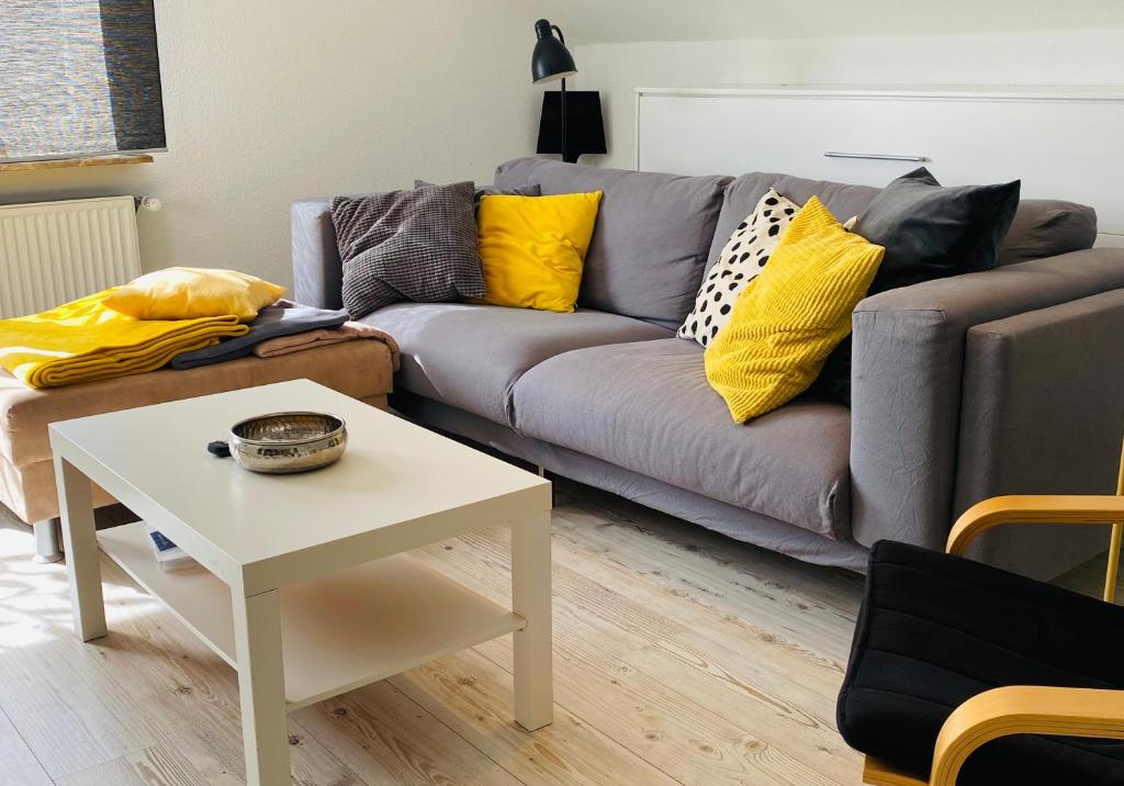 a living room with a couch and a table at Apartment in Bremen in Bremen