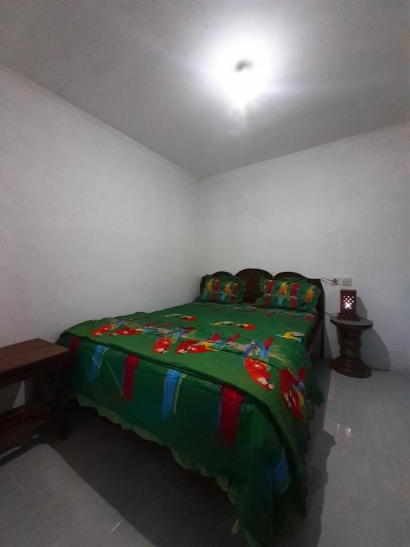 Postel nebo postele na pokoji v ubytování Tetebatu Sunrise Homestay