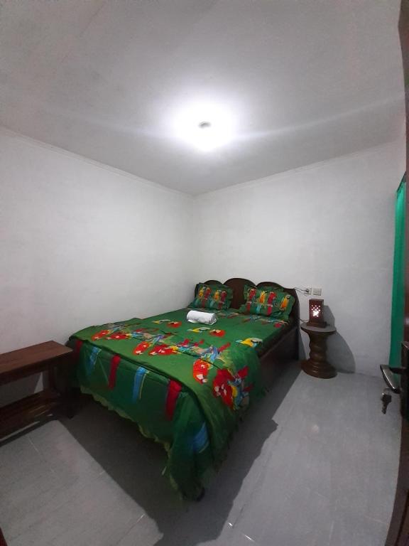 Postel nebo postele na pokoji v ubytování Tetebatu Sunrise Homestay