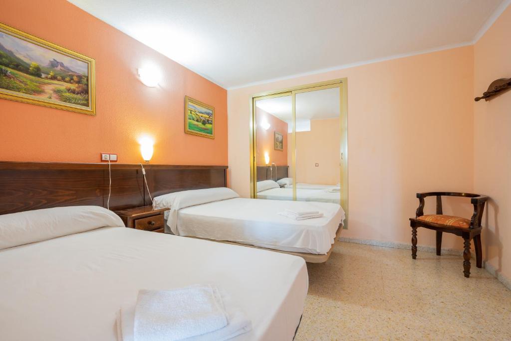Postel nebo postele na pokoji v ubytování Hotel Velis
