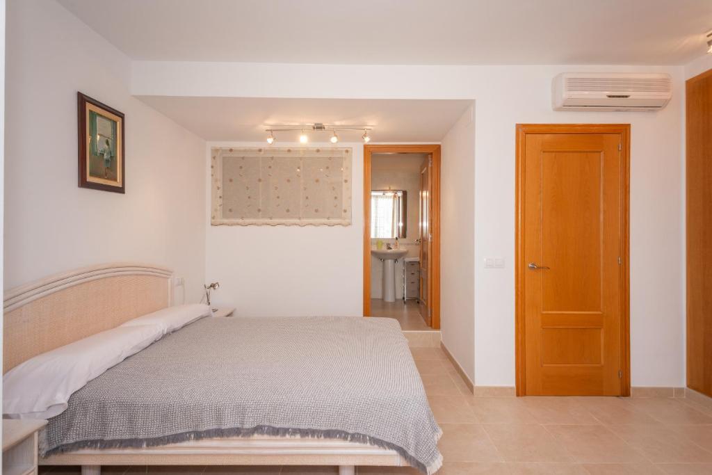Posteľ alebo postele v izbe v ubytovaní Casa Port Grec