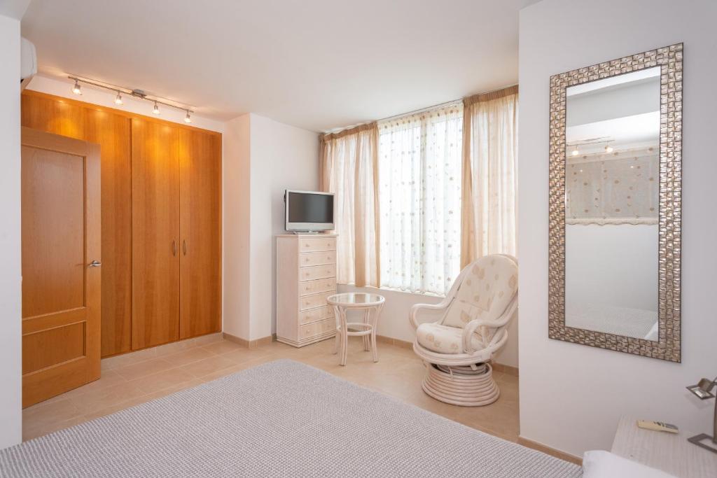 Televízia a/alebo spoločenská miestnosť v ubytovaní Casa Port Grec