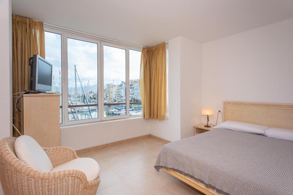 Posteľ alebo postele v izbe v ubytovaní Casa Port Grec