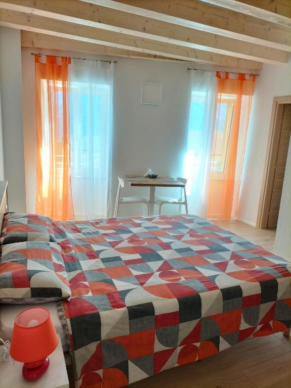 Postel nebo postele na pokoji v ubytování B&B Al Portico