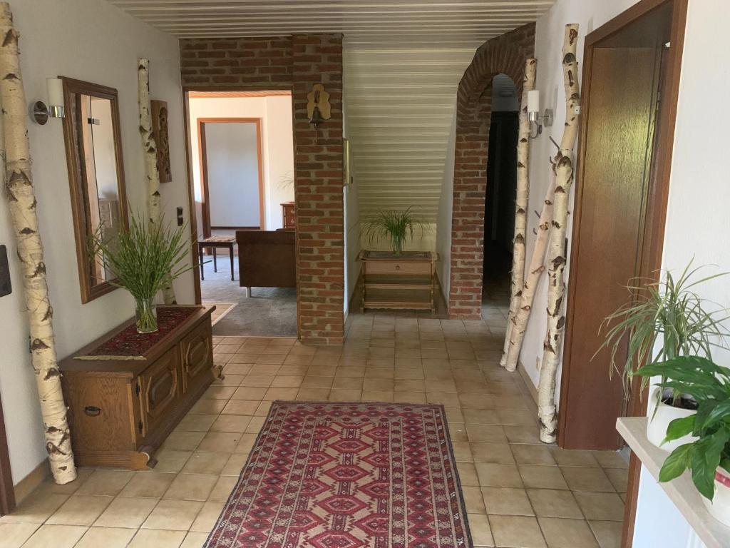 a hallway of a house with a rug on the floor at Eifeloase Sophia in Nettersheim