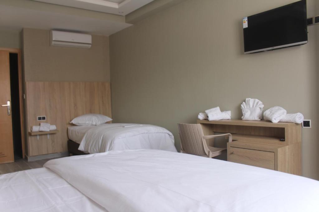 Postel nebo postele na pokoji v ubytování HOTEL CAFE PALAIS SALAM , Beni Mellal