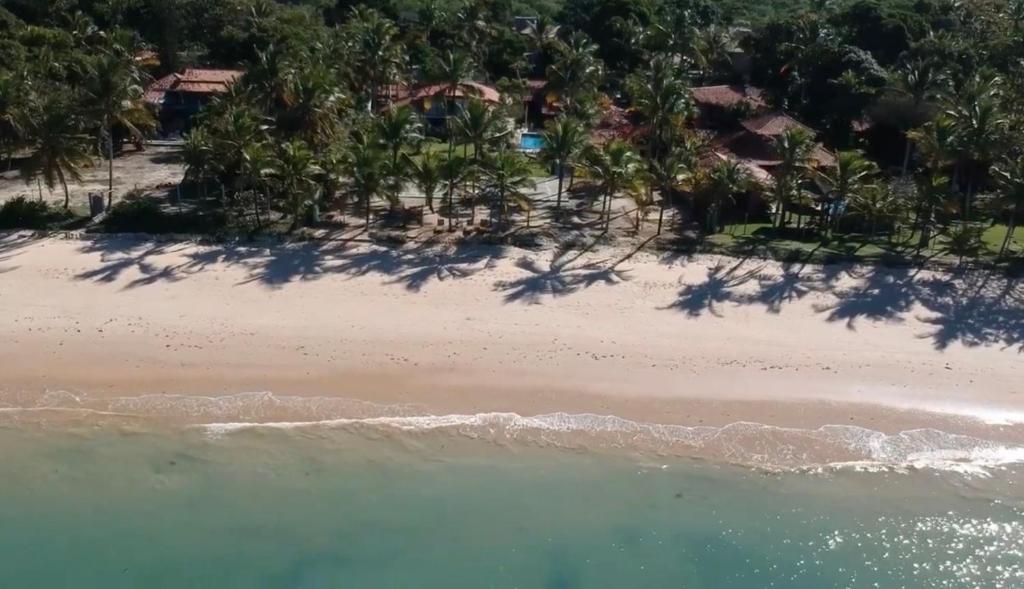an aerial view of a beach with trees at Pousada Villa Tainá - Arraial d'Ajuda, Bahia in Arraial d'Ajuda