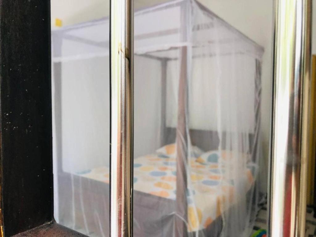 Postel nebo postele na pokoji v ubytování Sea Hub Resort Midigama