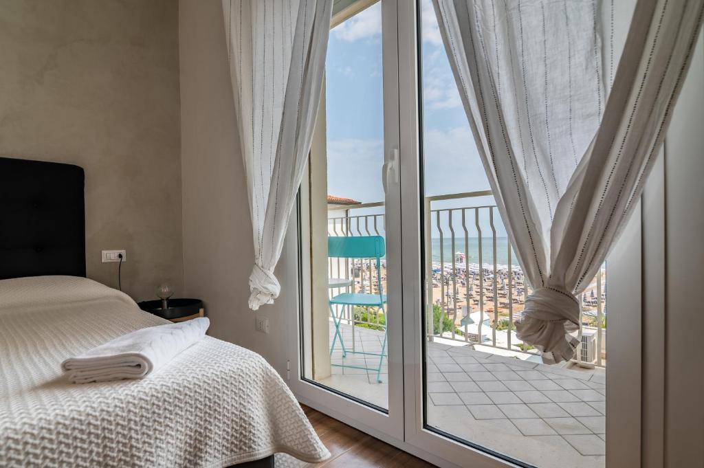 Postel nebo postele na pokoji v ubytování Hotel Concordia