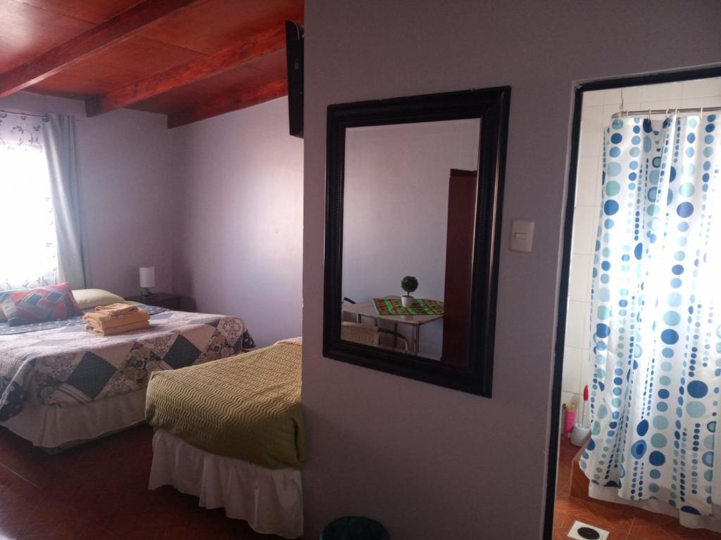 Postel nebo postele na pokoji v ubytování Hostal Nuevo Sol y Viento