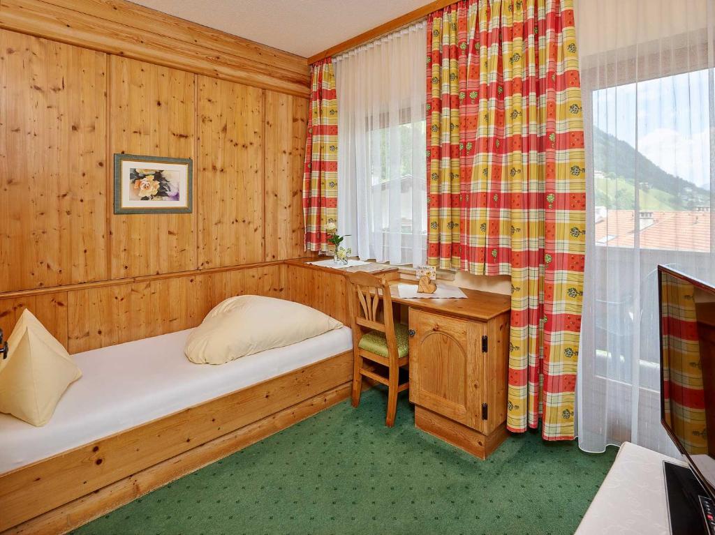Postel nebo postele na pokoji v ubytování Hotel Sonnhof