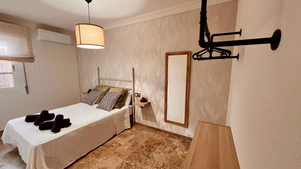 Postel nebo postele na pokoji v ubytování Boho Apartment Lucano 01