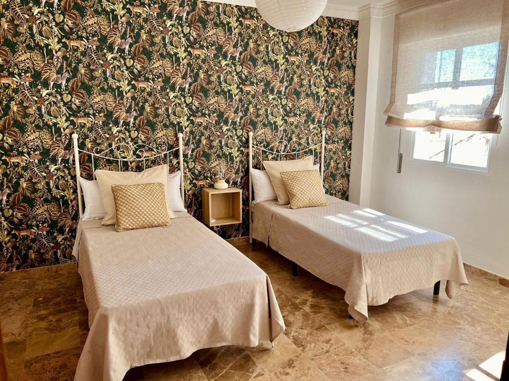 Postel nebo postele na pokoji v ubytování Boho Apartment Lucano 01