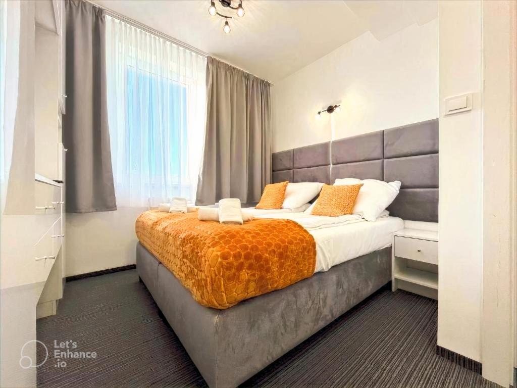 Postel nebo postele na pokoji v ubytování Apartament Premium 214 Planeta Mielno - balkon, klimatyzacja, 100 m od plaży