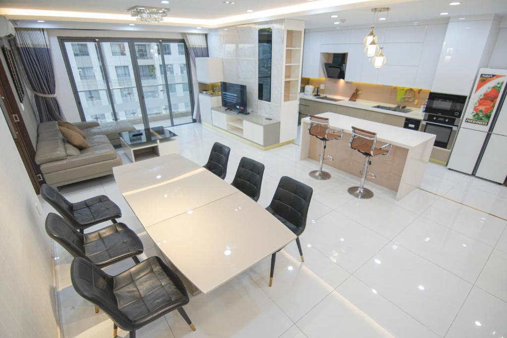an overhead view of a living room and kitchen with a table and chairs at Luxury Gold Apartment 86 -Rooftop Pool Central City in Ho Chi Minh City