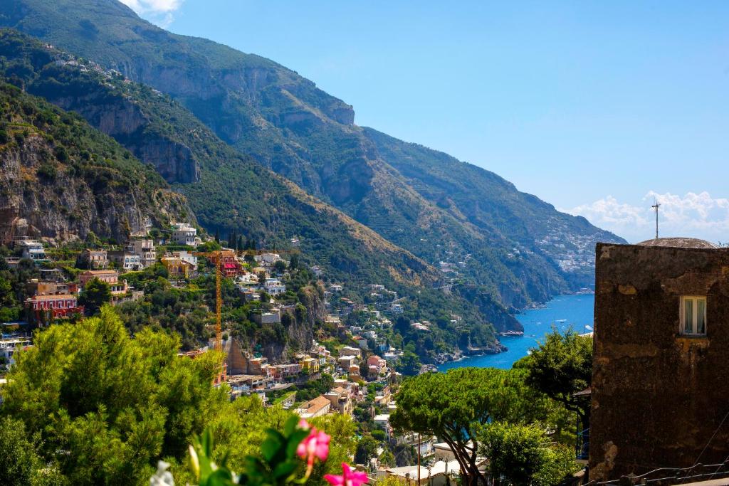 a view of a valley with a river and mountains at The Positaner in Positano