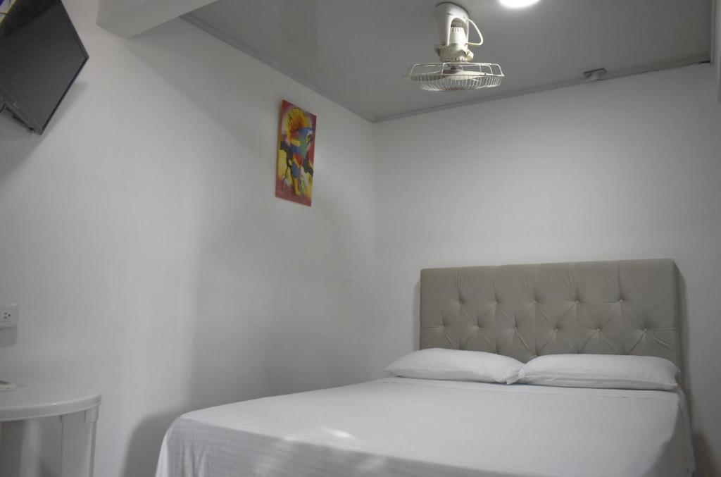 Postel nebo postele na pokoji v ubytování BOUTIQUE HOTEL BALOP Valledupar