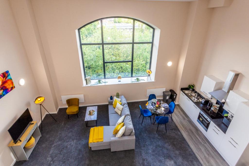 an overhead view of a living room with a large window at The Arc - Stunning Luxury 2 Bed Duplex Apartment in Newcastle upon Tyne