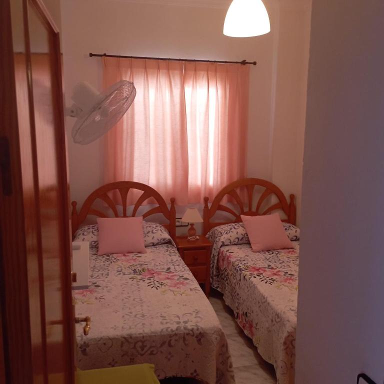 Postel nebo postele na pokoji v ubytování Ático Los Arcos