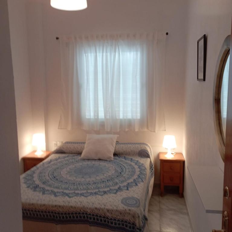 Postel nebo postele na pokoji v ubytování Ático Los Arcos