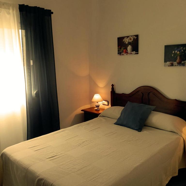 Postel nebo postele na pokoji v ubytování Ático Los Arcos