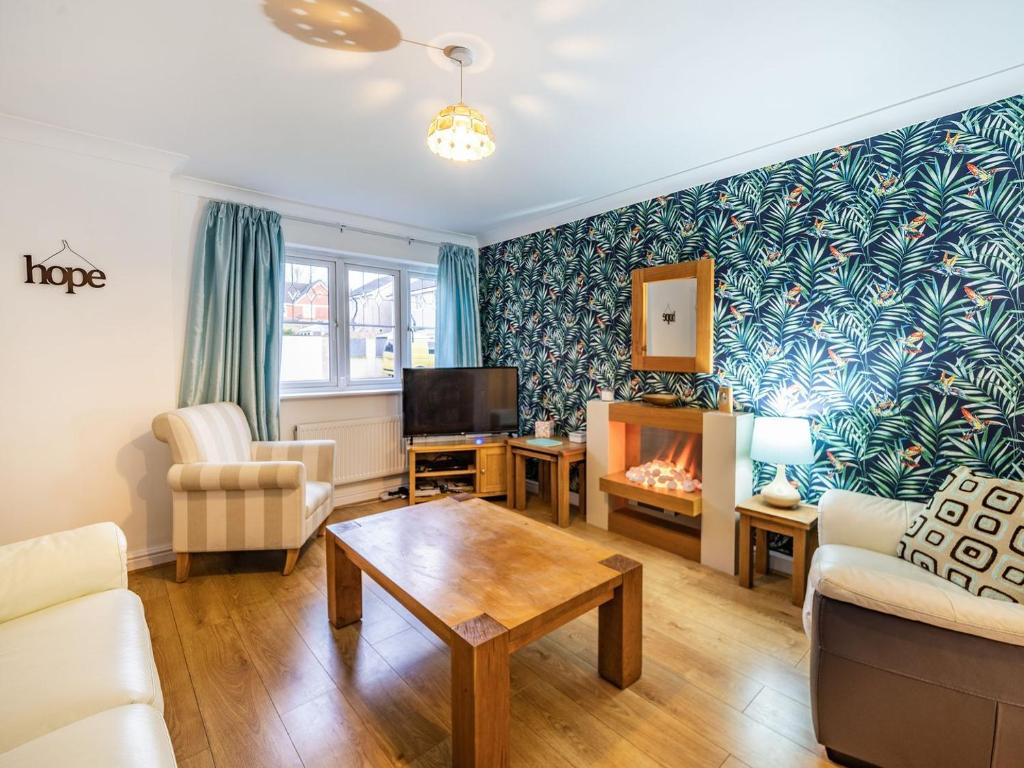 a living room with a couch and a table at Monument Way in Ulverston