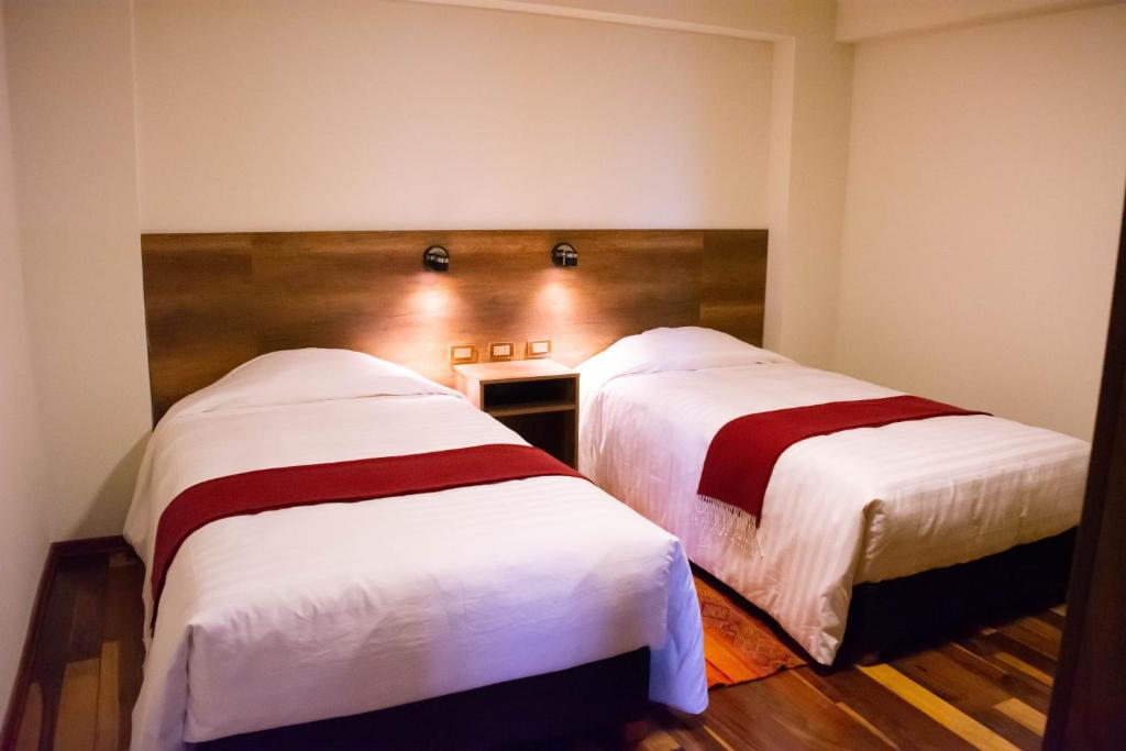 Postel nebo postele na pokoji v ubytování Zans Apartments Cusco
