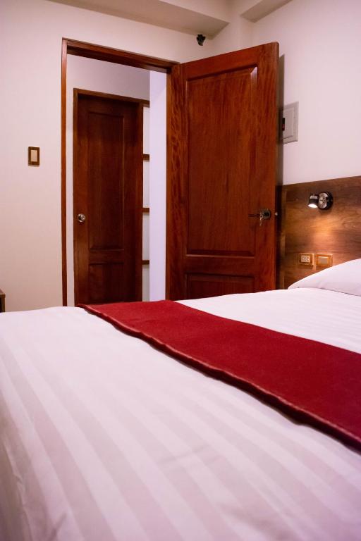 Postel nebo postele na pokoji v ubytování Zans Apartments Cusco