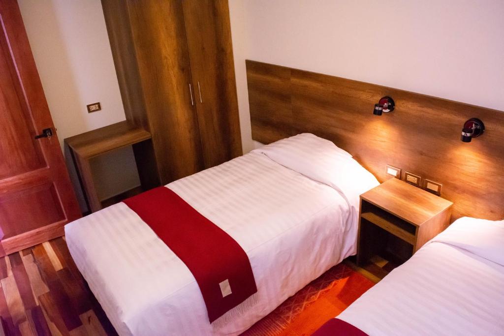 Postel nebo postele na pokoji v ubytování Zans Apartments Cusco