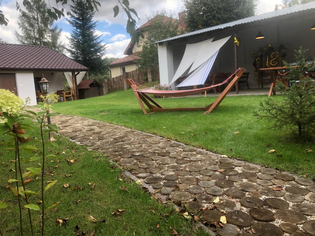 a hammock in the yard of a house at Pod Świerkami 