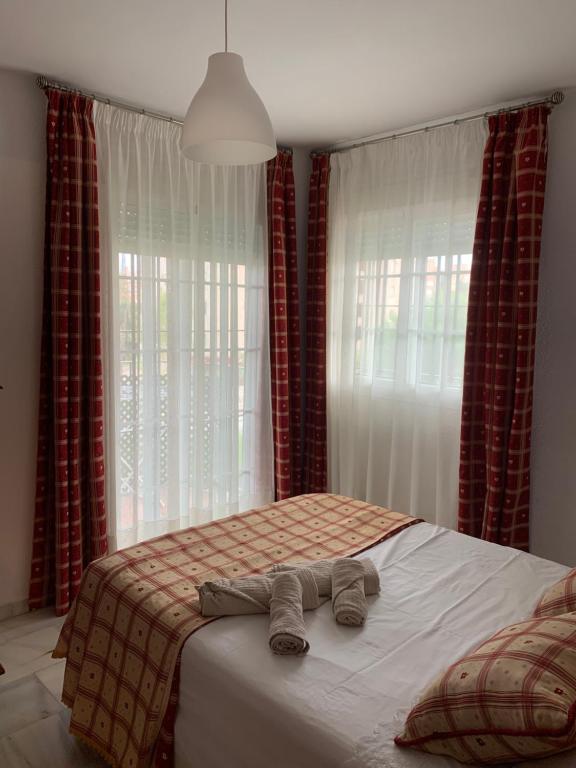 Postel nebo postele na pokoji v ubytování Apartamento Carihuela a 300 metros playa