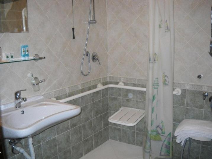 Koupelna v ubytování Hotel Rigolfo