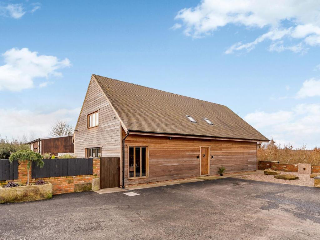 a large wooden barn with a garage at Olive Lodge in Melbourne