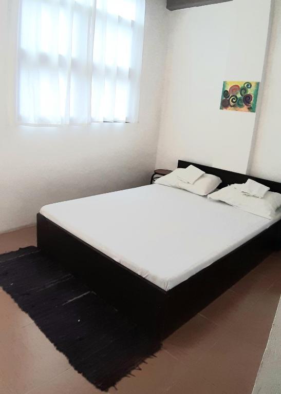 Postel nebo postele na pokoji v ubytování Angel and Marie's ACroom for 1-2pax